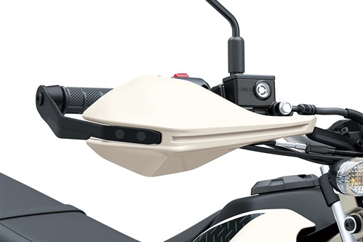 Close-up view of the right handguard of a motorcycle staged in a white studio background. opens in a new window