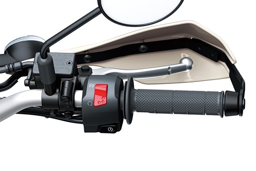 Close-up view of the right handlebar of a motorcycle staged in a white studio background. opens in a new window
