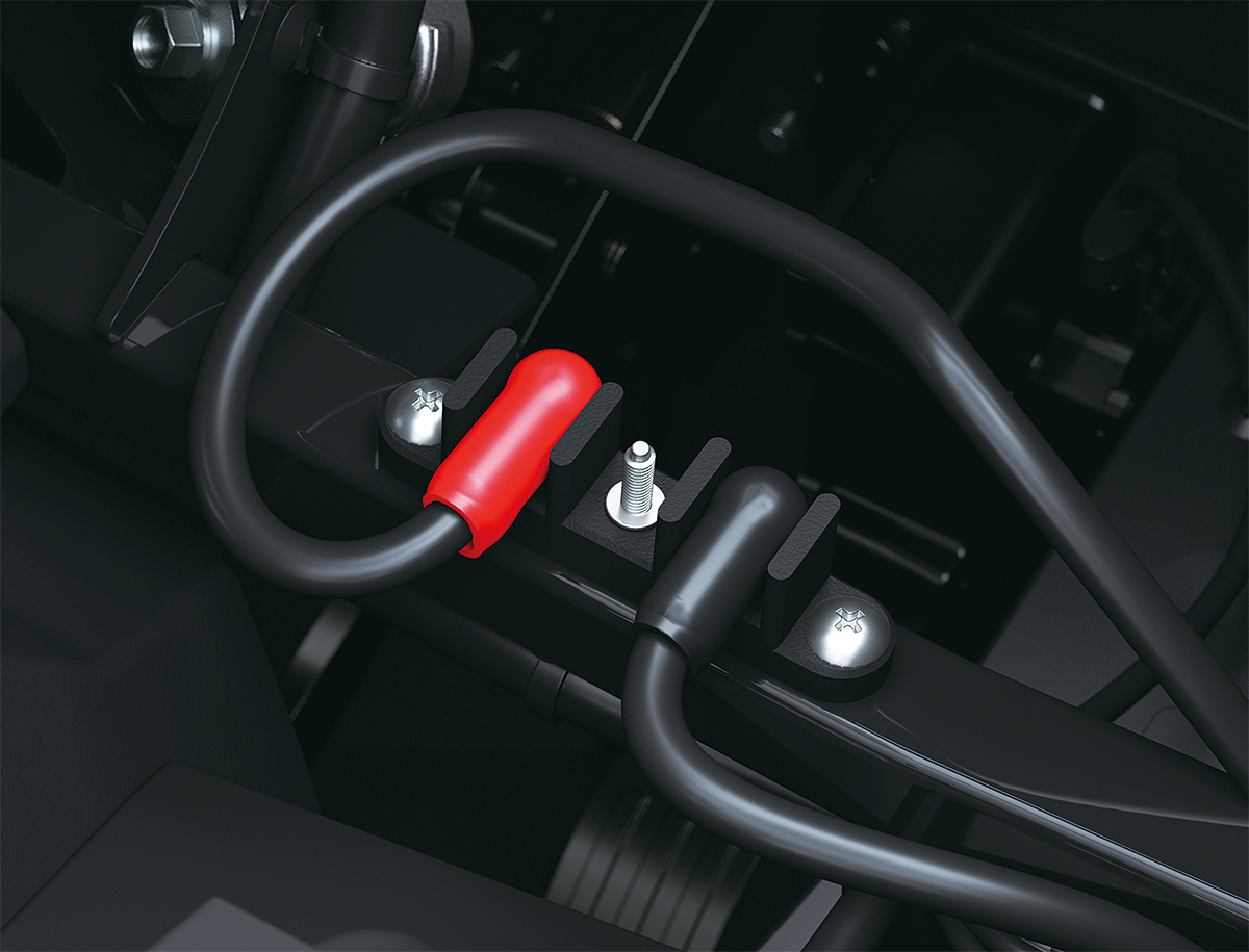 Close-up view of the battery terminal of a side x side staged in a white studio background.