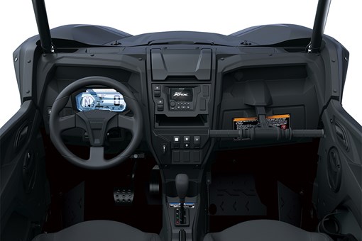 Center POV of the steering wheel and dashboard of a side x side staged in a white studio background. opens in a new window