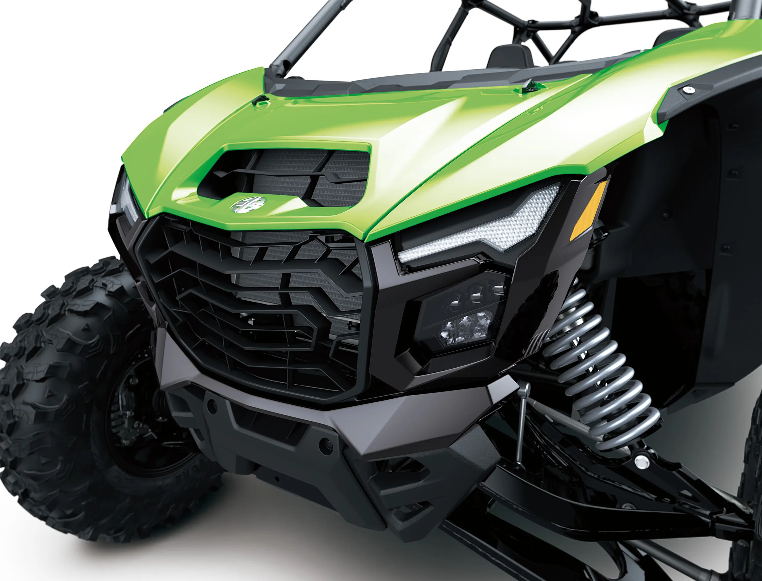 Close-up front three-quarter of the front end of a side x side in a white studio background.