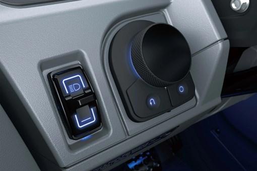 Close-up of interior controls on a side x side in a white studio background. opens in a new window