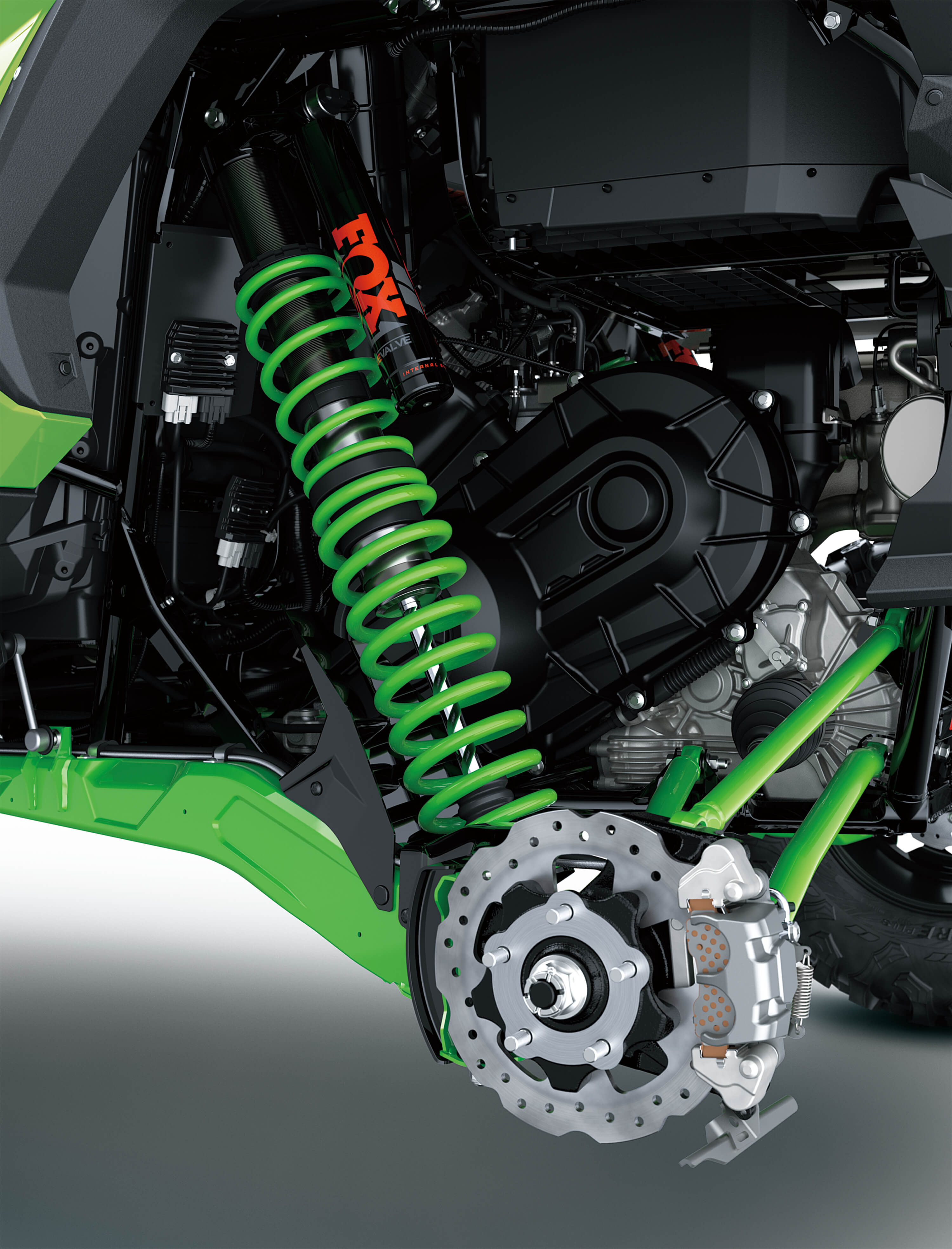 Another close-up of suspension of a side x side in a white studio background.