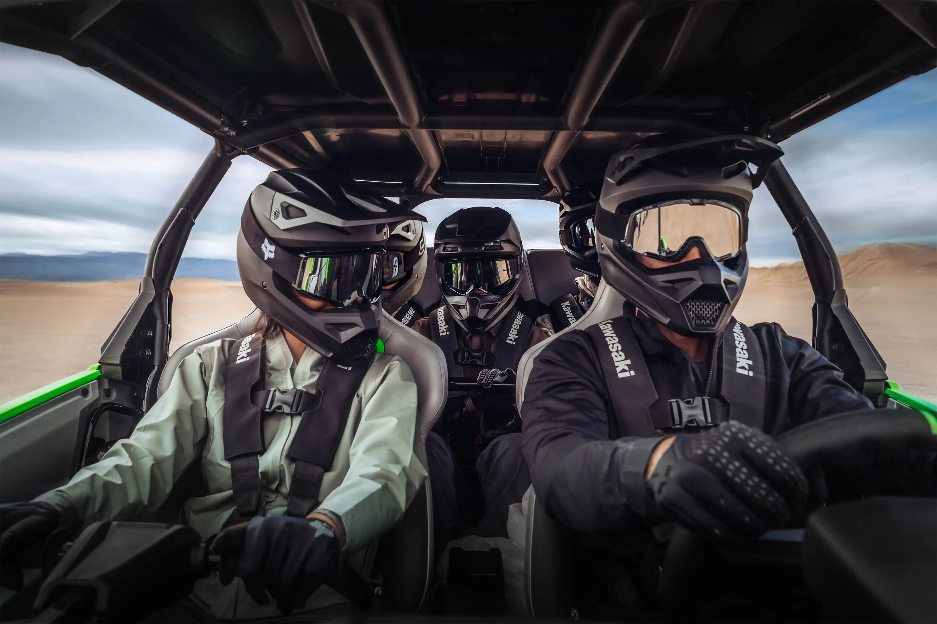 Inside a side x side with a driver and two passengers.