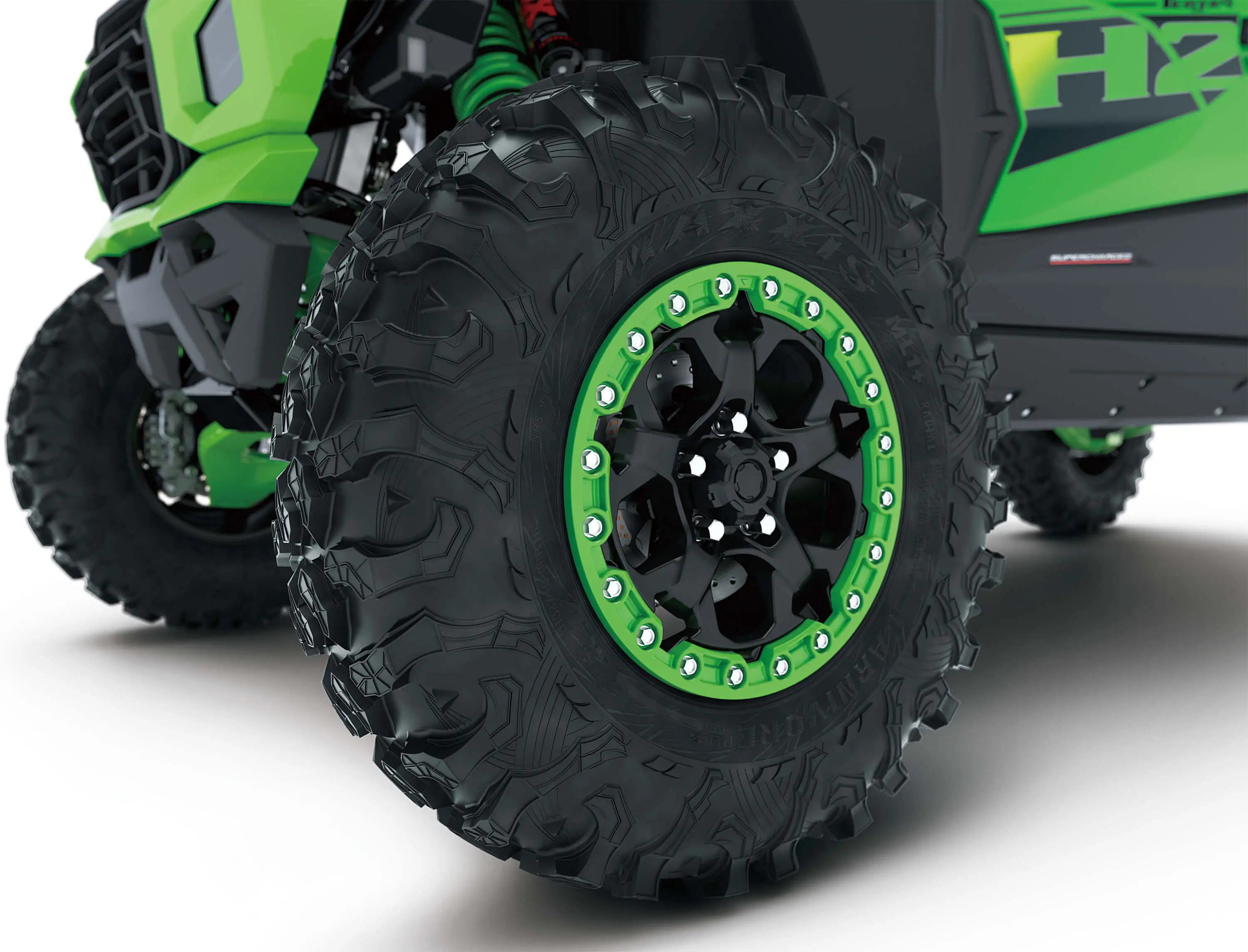 Close-up of wheels of a side x side in a white studio background.