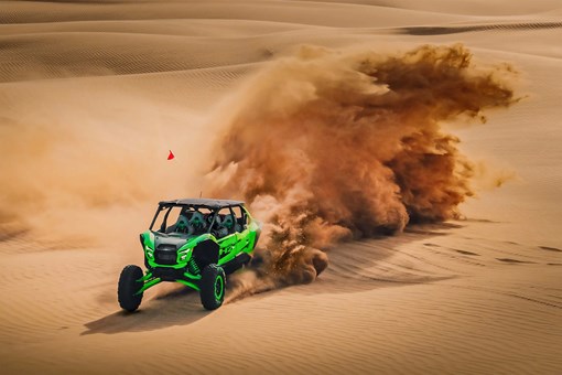 Overhead front angle of a person driving a side x side off-road. opens in a new window