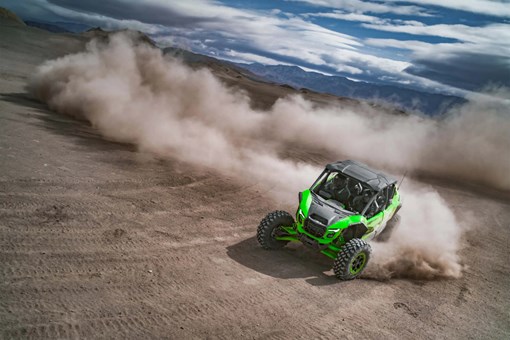Overhead angle of a person driving a side x side off-road. opens in a new window