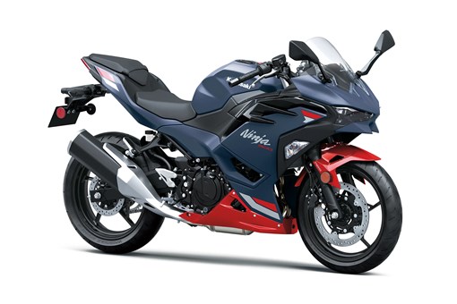 Three-quarter front angle of a blue motorcycle staged in a white studio background. opens in a new window