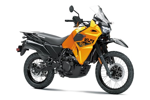 Three-quarter front angle of an orange motorcycle staged in a white studio background. opens in a new window