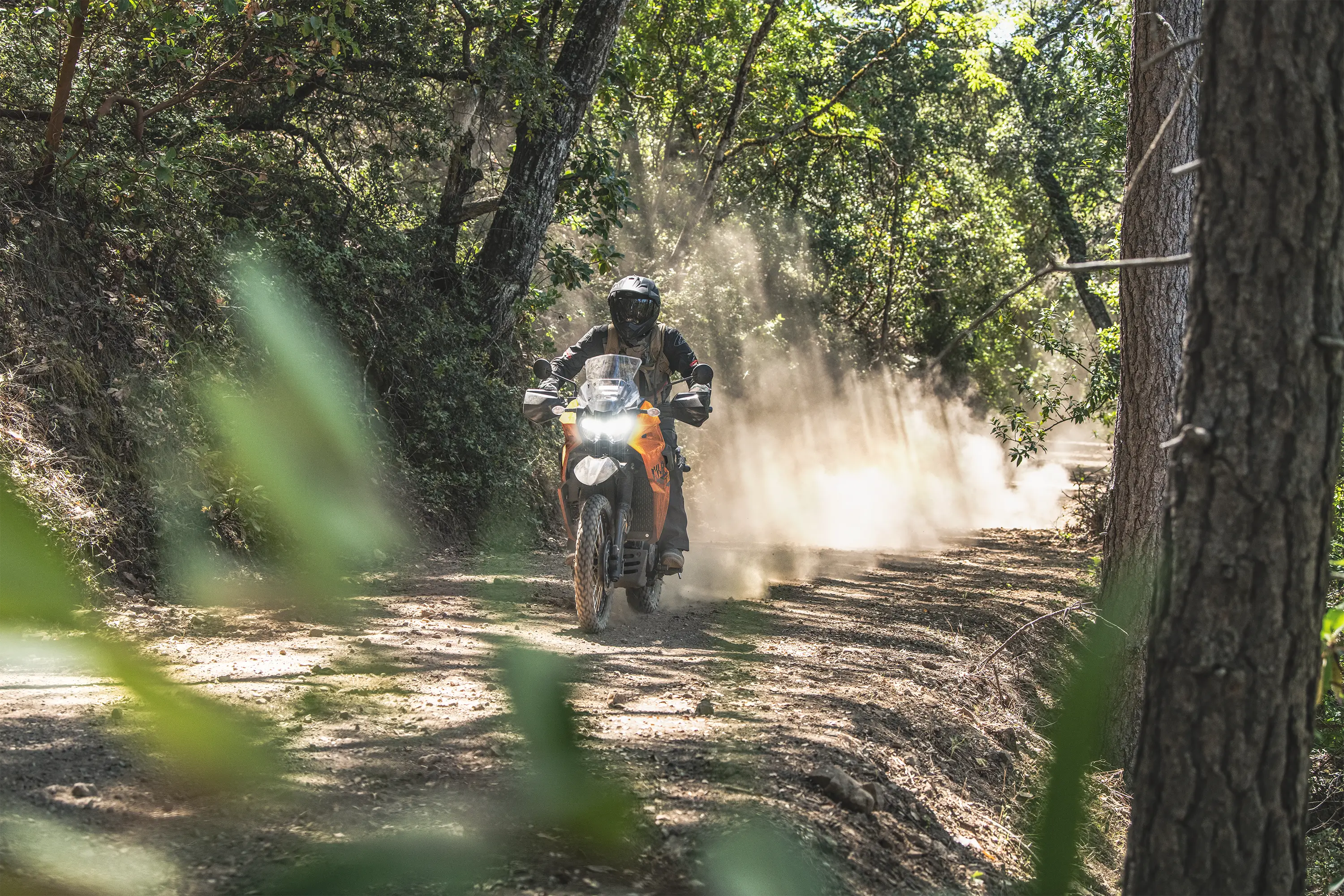 Front angle of a person riding a motorcycle off-road.