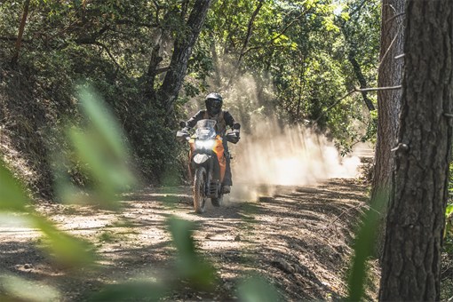 Front angle of a person riding a motorcycle off-road. opens in a new window