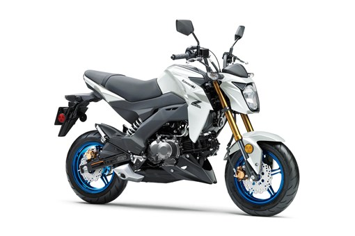 Three-quarter front angle of a white motorcycle staged in a white studio background. opens in a new window