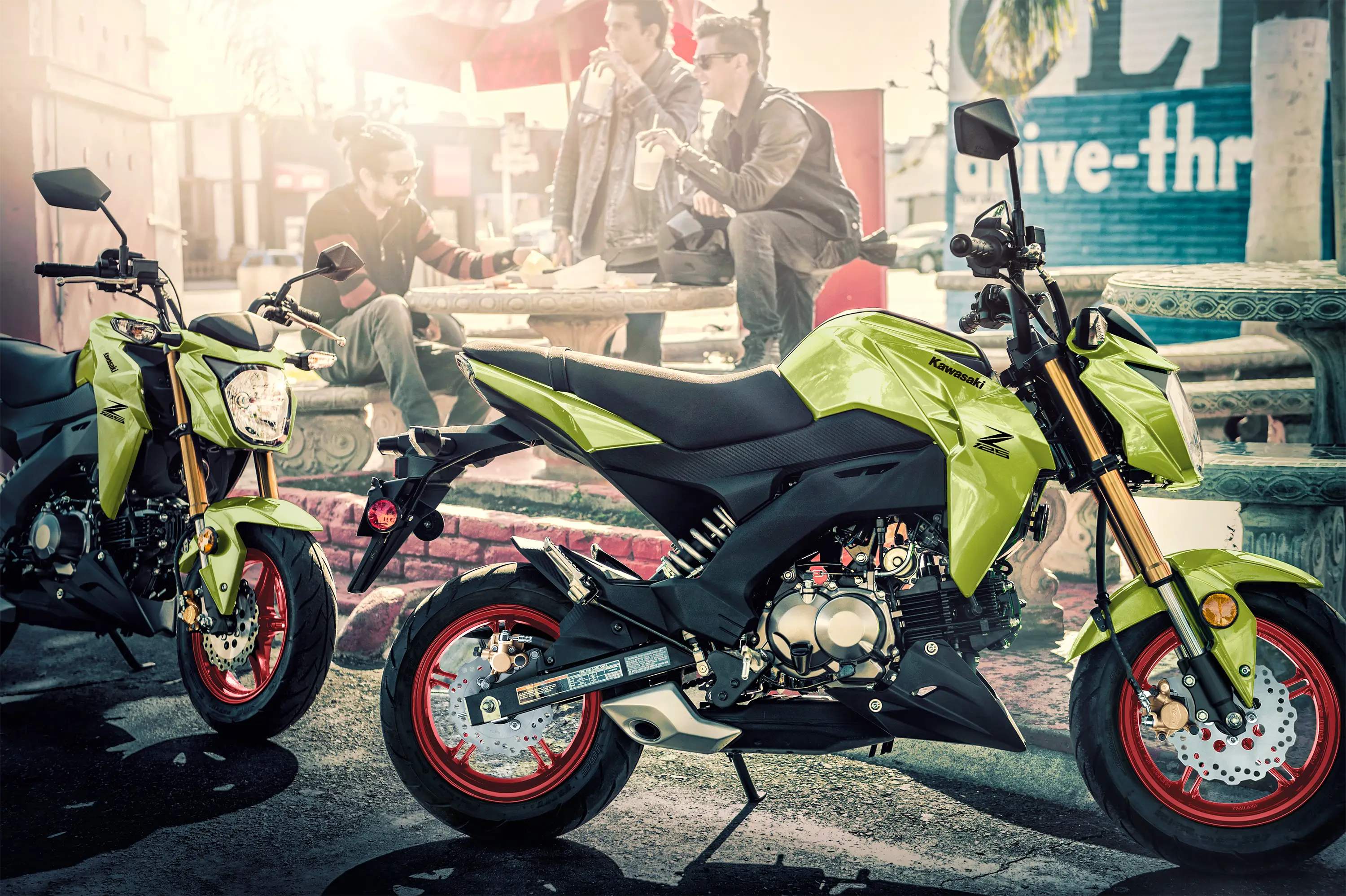 Side angle of two motorcycles parked.