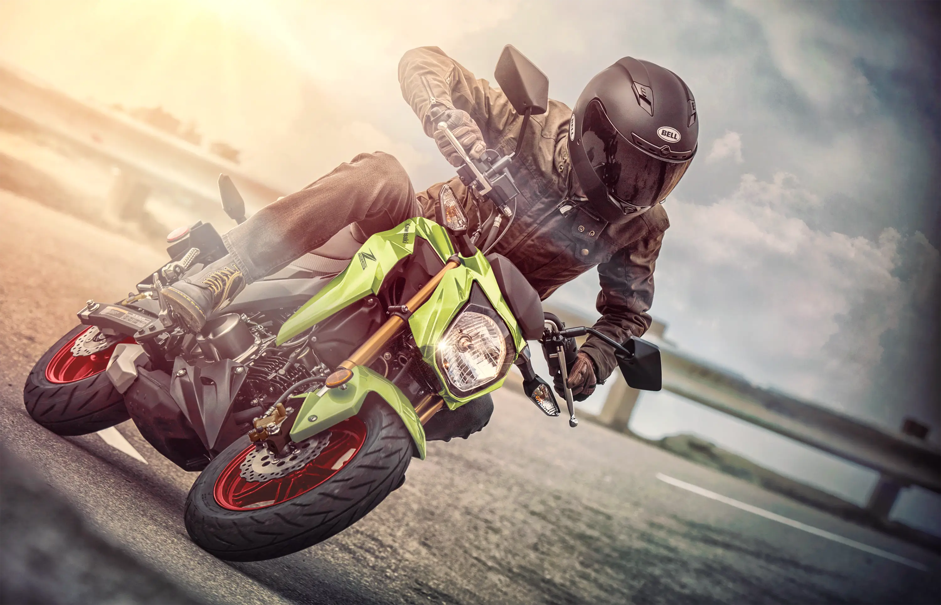 Front angle of a person riding a motorcycle on a highway.