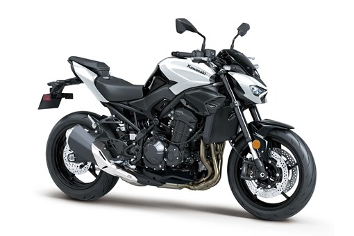 Three-quarter front angle of a motorcycle with white accents staged in a white studio background. opens in a new window