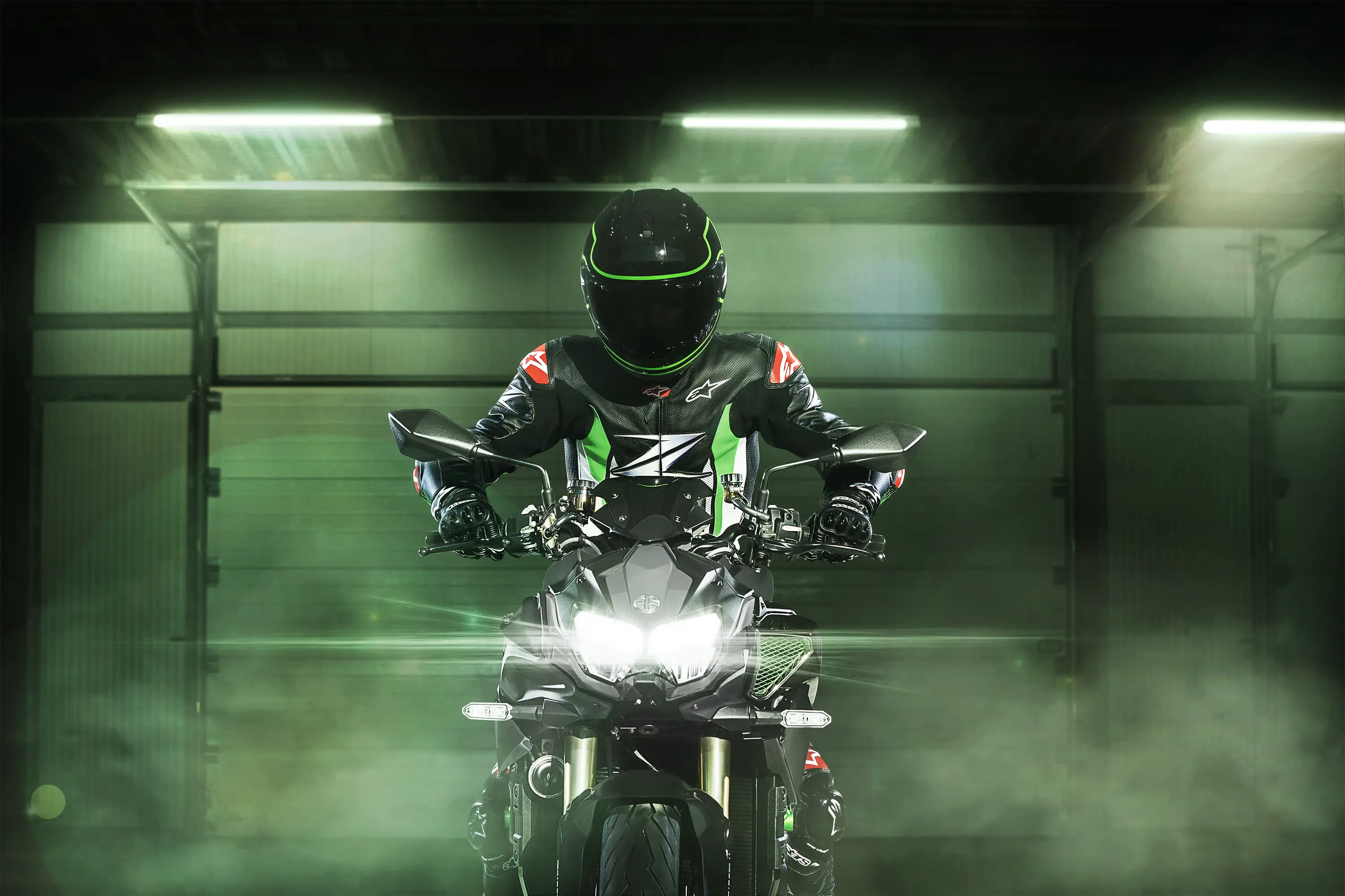 Front angle of a motorcycle staged in a green studio background.