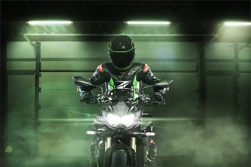Front angle of a motorcycle staged in a green studio background. opens in a new window