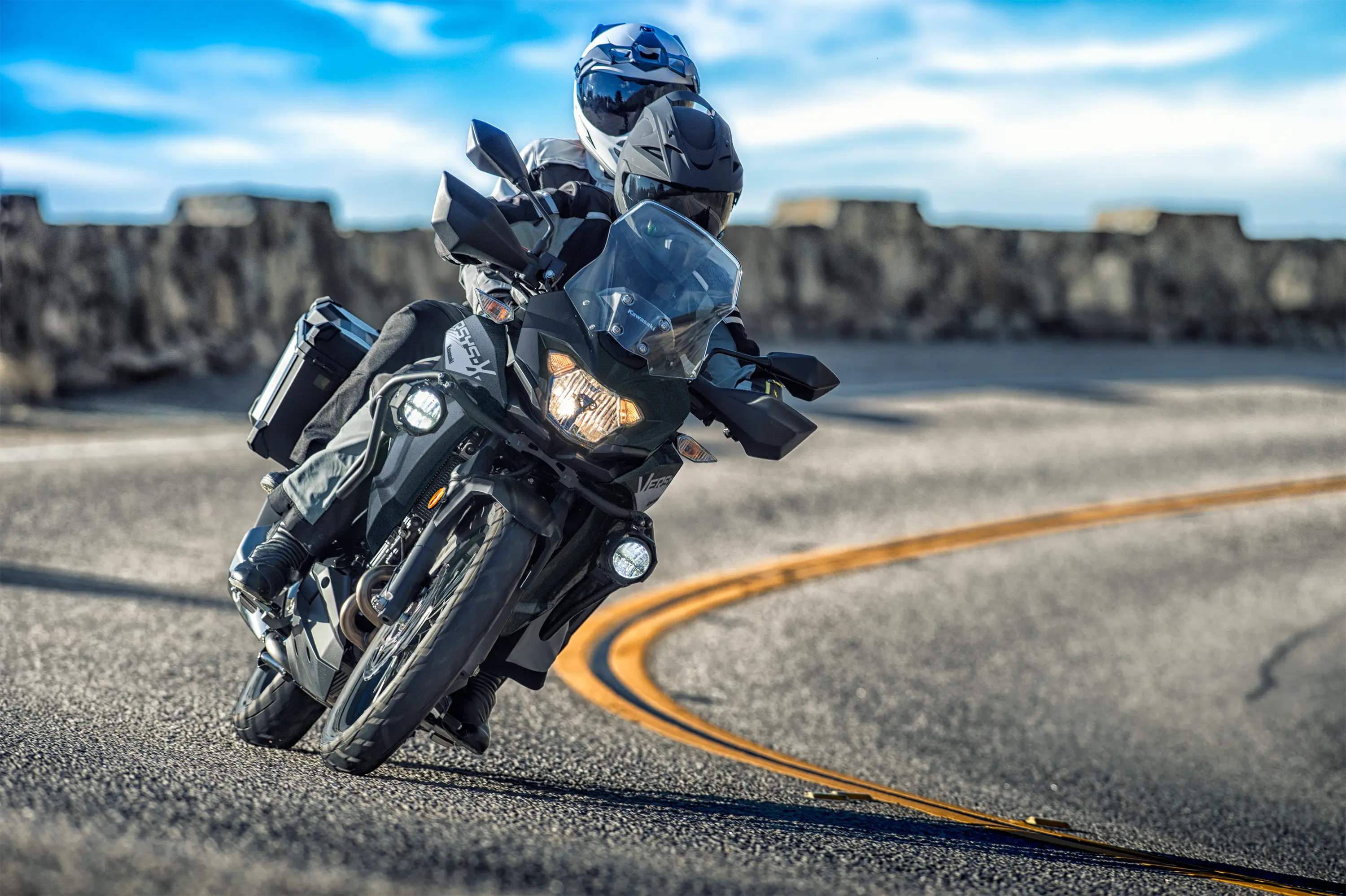 Front angle of a person riding a motorcycle on a highway.