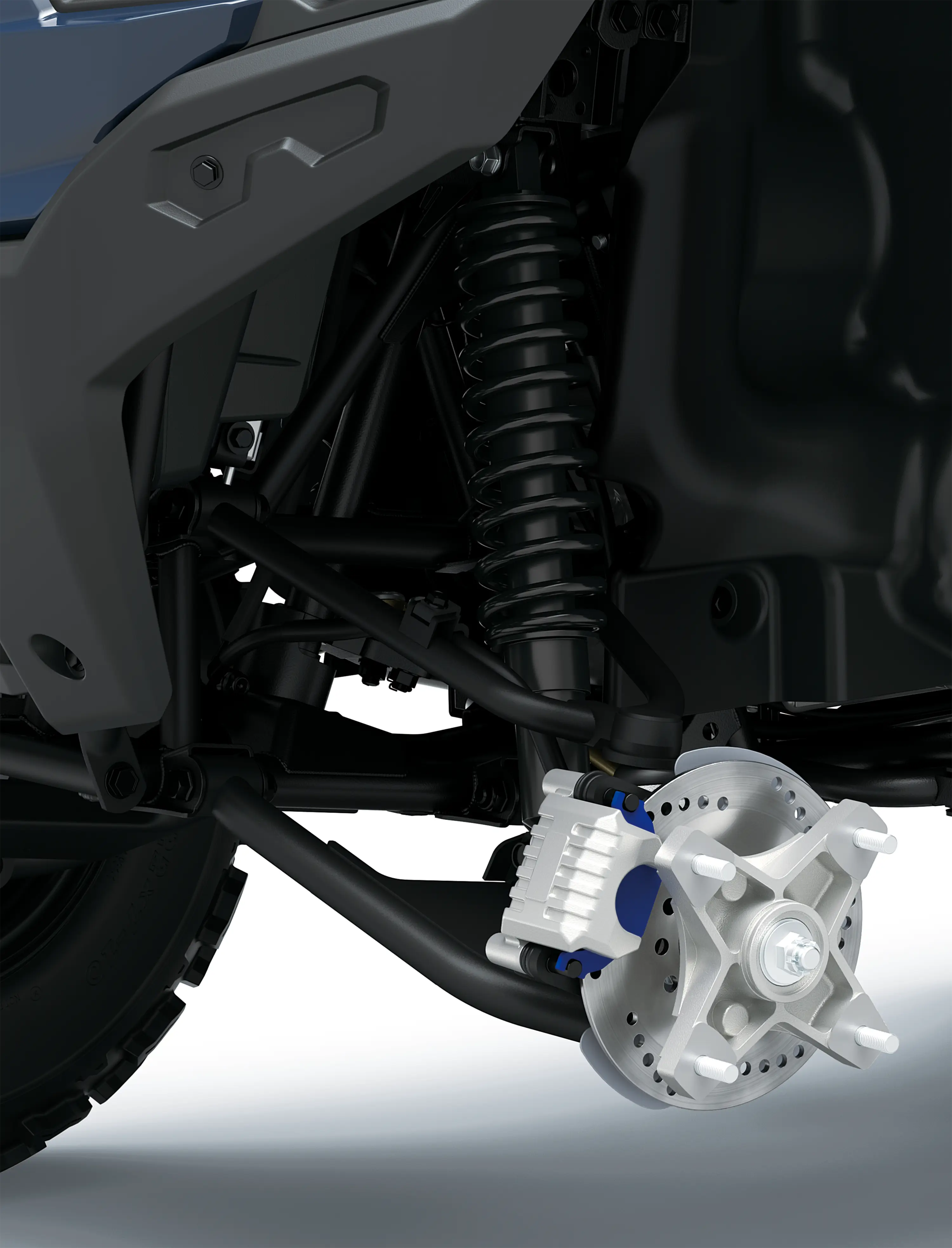 Closeup detail of brakes of an ATV staged in a white studio background.