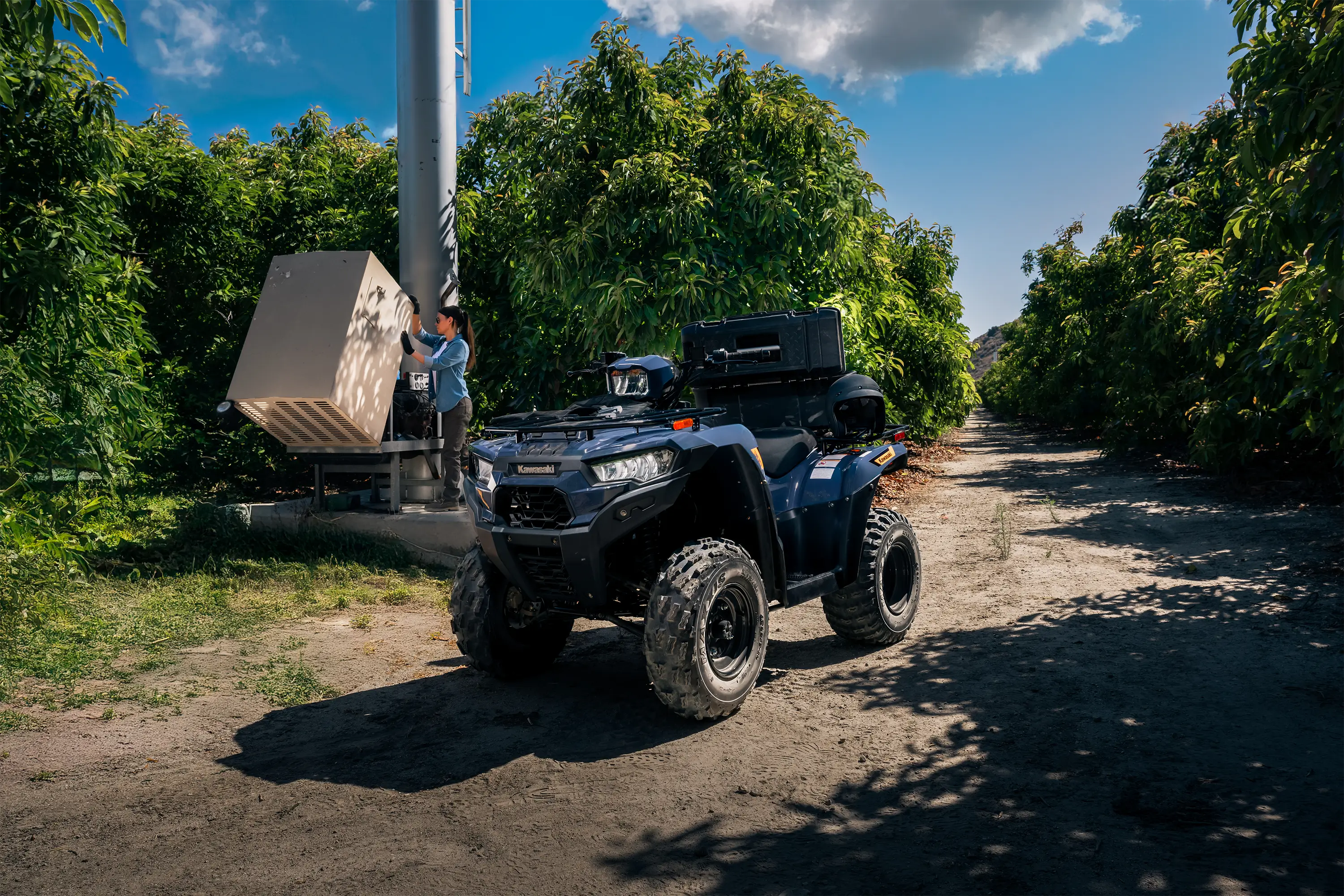 Front three-quarter angle of an ATV parked off-road.