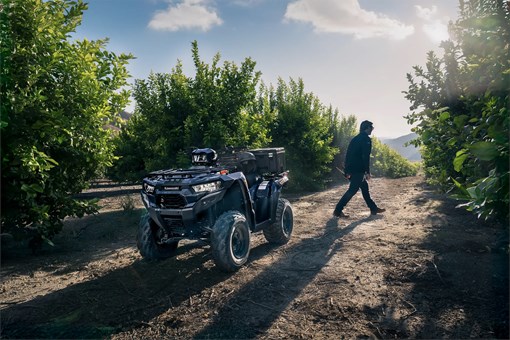 Three-quarter front angle of an ATV parked off-road. opens in a new window
