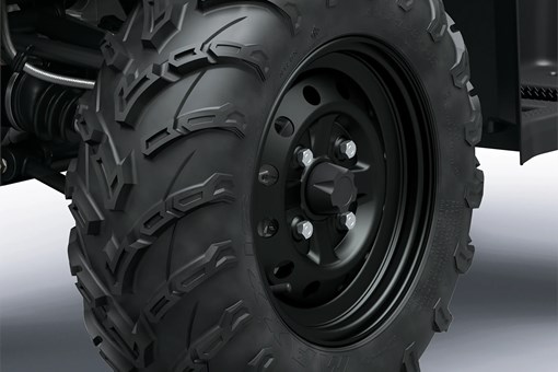 Closeup detail of wheels on an ATV staged in a white studio background. opens in a new window