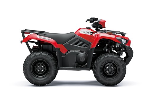Profile angle of a red ATV staged in a white studio background. opens in a new window
