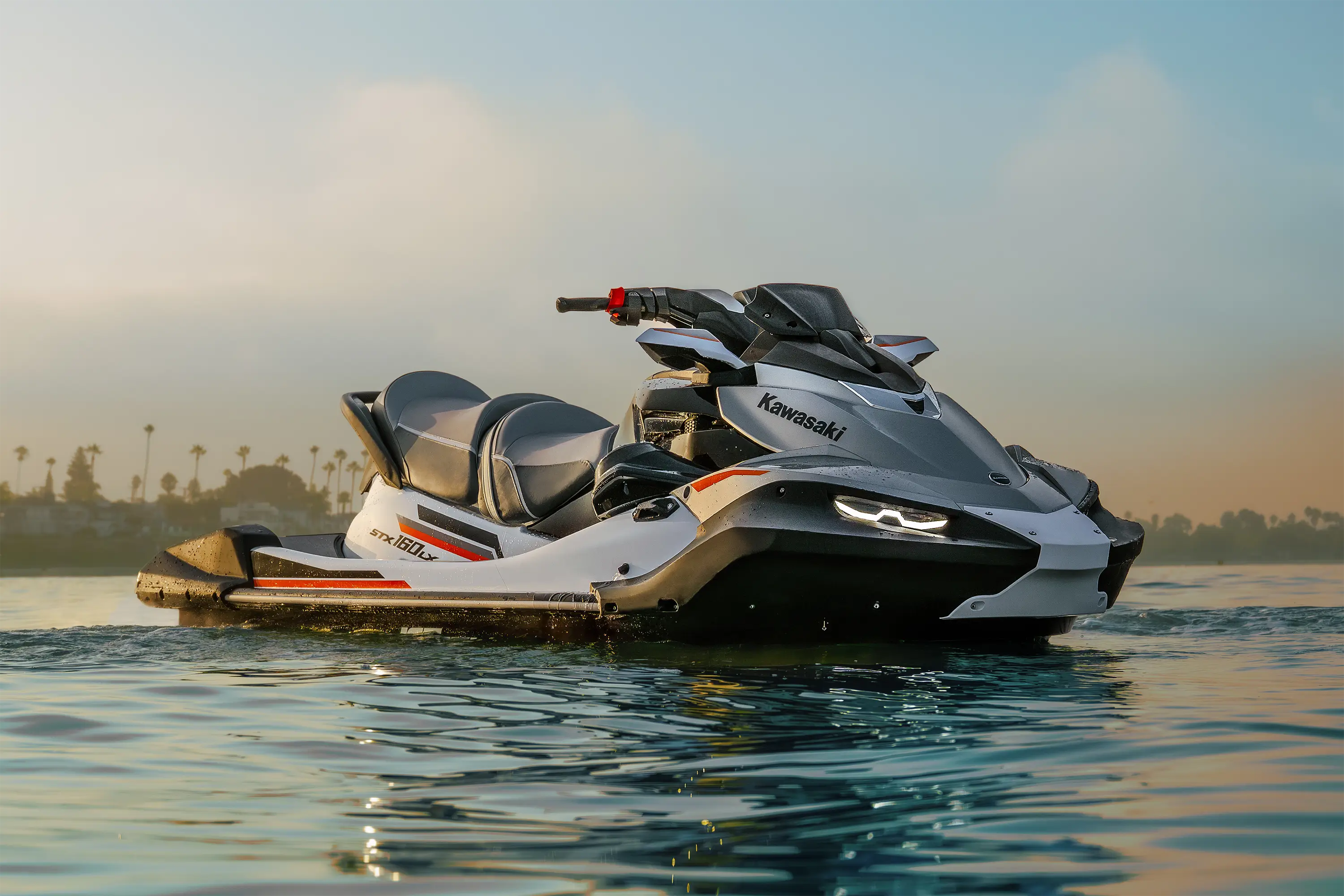 Side angle of a personal watercraft stopped on the water.