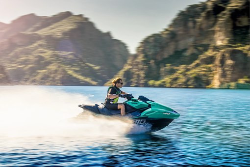 Profile angle of a person on a personal watercraft on the water. opens in a new window