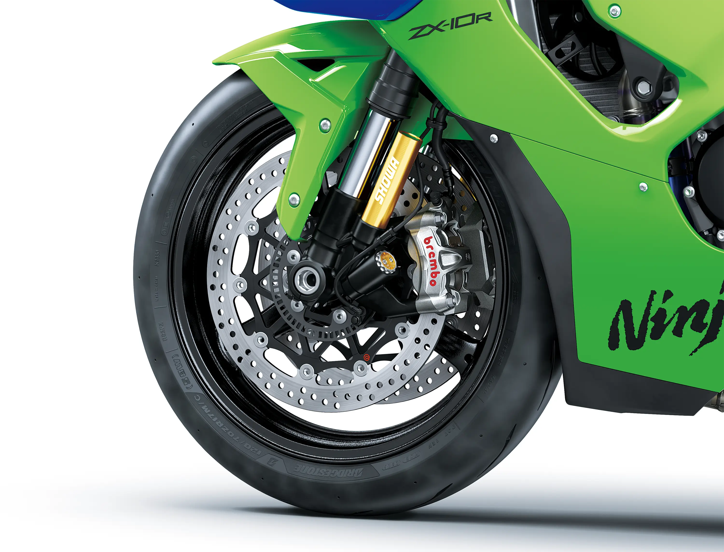 Close-up of the front tire of a motorcycle staged in a white studio background.