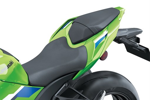 Close-up of the seat of a motorcycle staged in a white studio background. opens in a new window