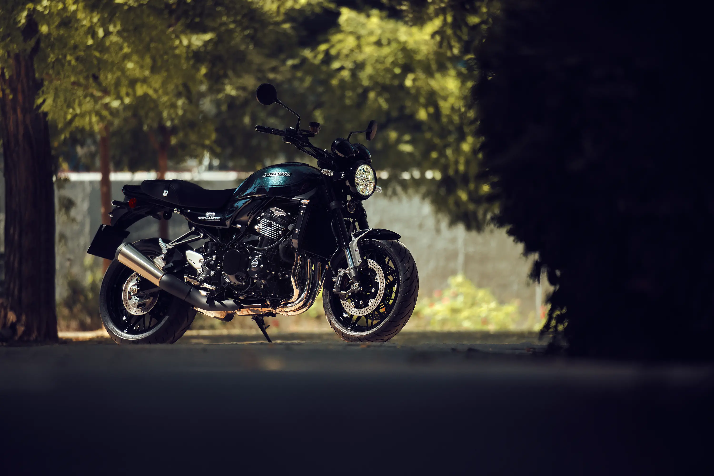 Side angle of a motorcycle staged on a road.