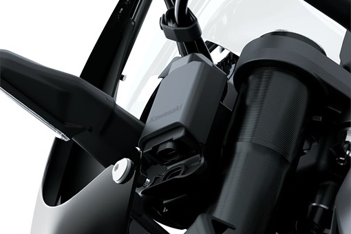 Close-up of the smartphone connectivity module of a motorcycle staged in a white studio background. opens in a new window