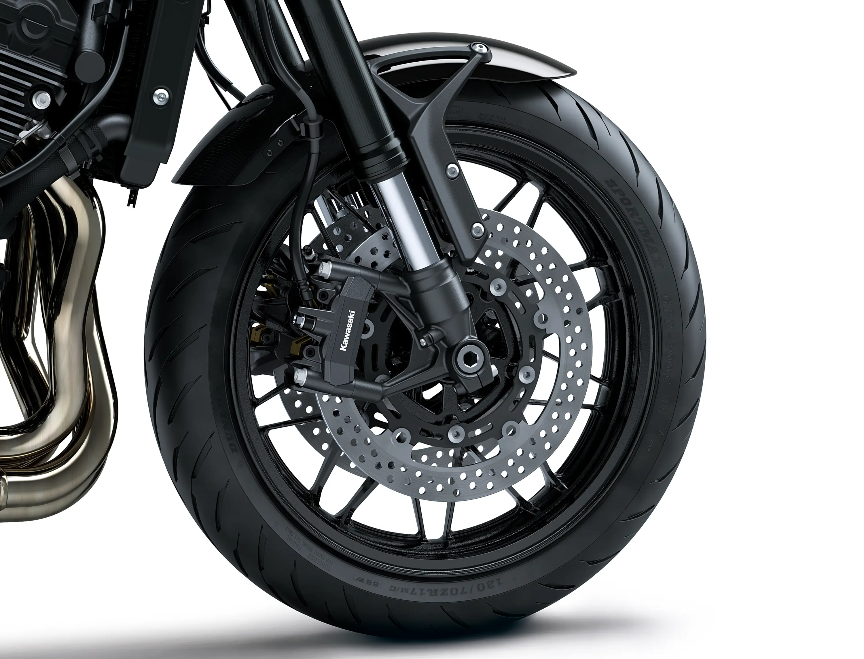 Close-up of the front tire of a motorcycle staged in a white studio background.