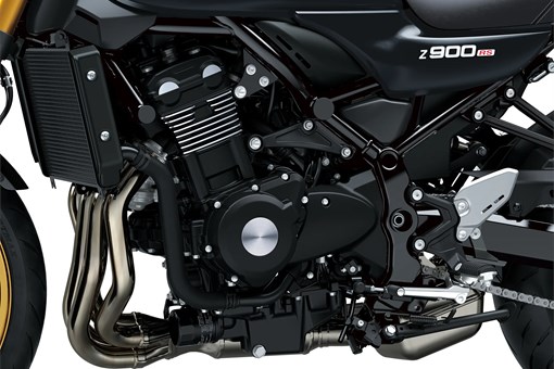 Close-up of the engine bay of a motorcycle staged in a white studio background. opens in a new window