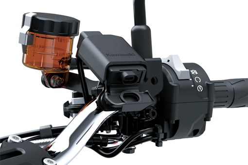 Close-up of the handlebar and controls of a motorcycle staged in a white studio background. opens in a new window
