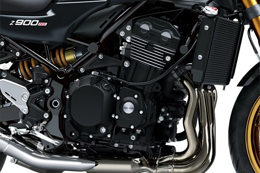 Close-up, right-side view of the engine bay of a motorcycle staged in a white studio background. opens in a new window