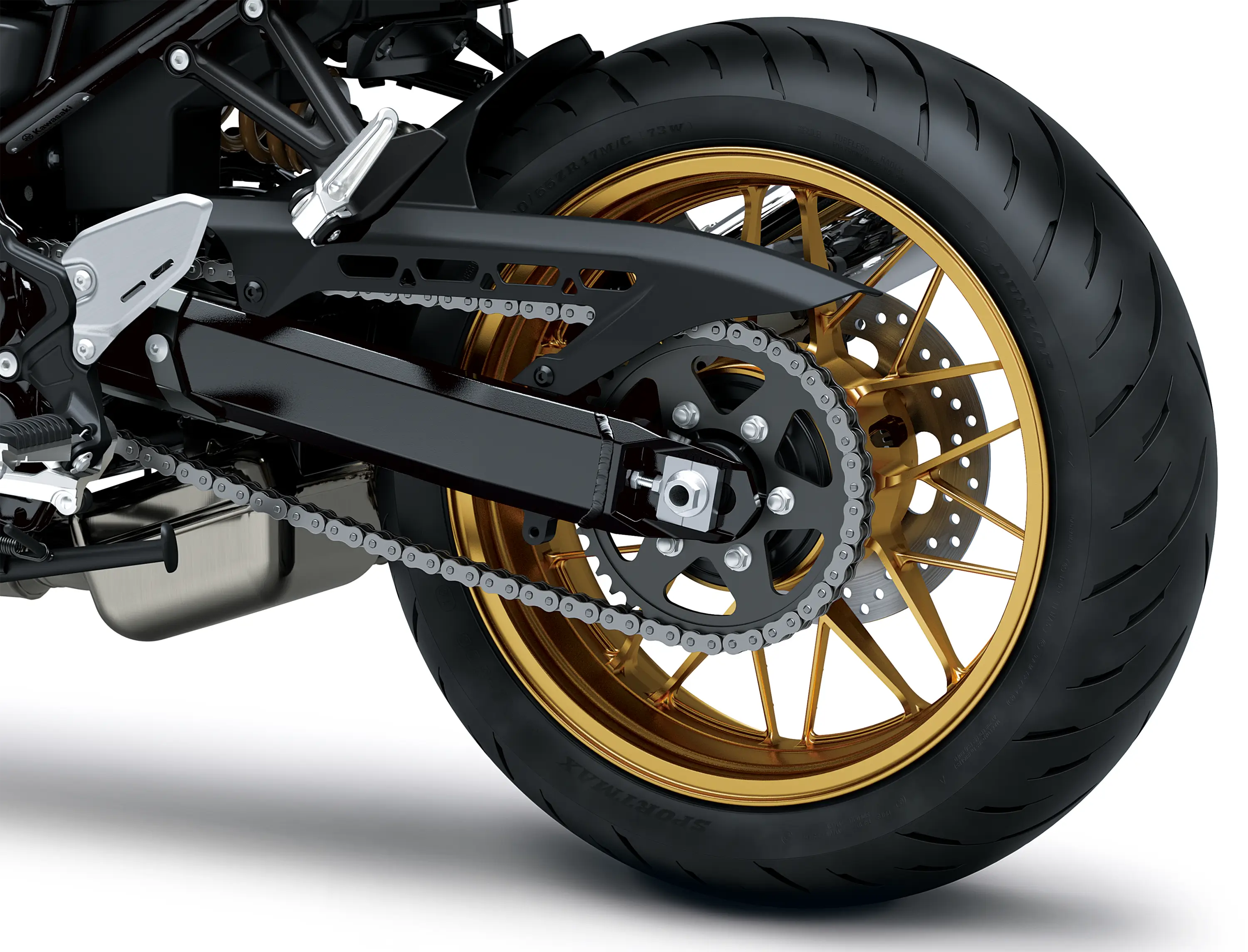 Close-up of the rear tire of a motorcycle staged in a white studio background.