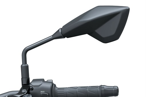 Closeup on mirror of a motorcycle staged in a white studio background. opens in a new window