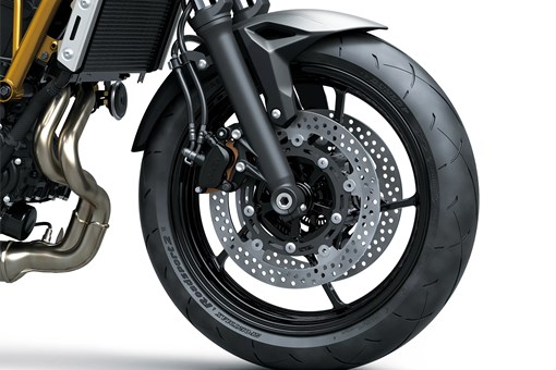 Front wheel of a motorcycle staged in a white studio background. opens in a new window