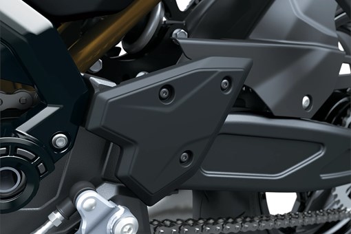 Chain of a motorcycle staged in a white studio background. opens in a new window