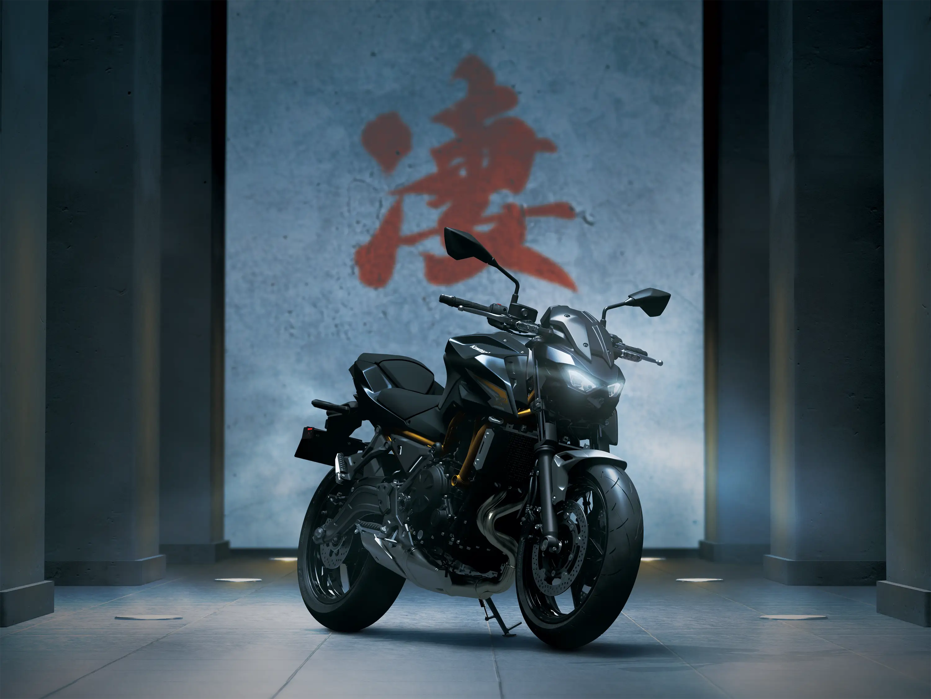 Three-quarter front angle of a motorcycle staged in black studio background.