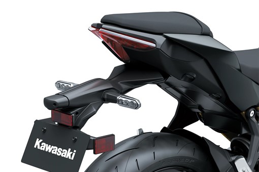 Plate on the back of a motorcycle staged in a white studio background. opens in a new window