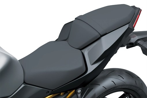 Seat of a motorcycle staged in a white studio background. opens in a new window