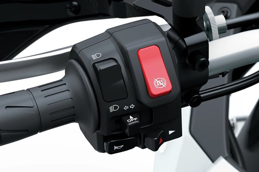 Closeup of handlebar of a motorcycle staged in a white studio background. opens in a new window