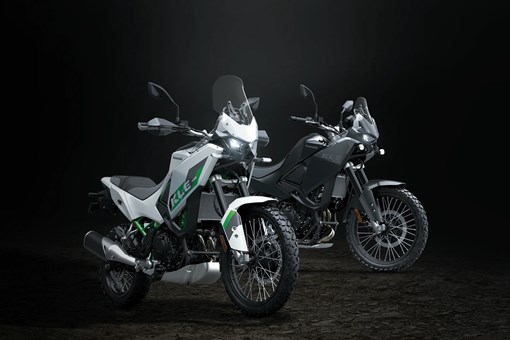 Three-quarter front angle of two motorcycles staged in a black studio background. opens in a new window