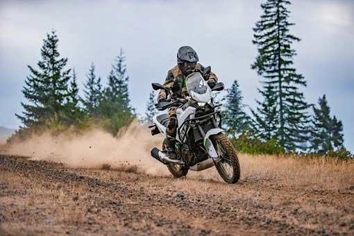 Three-quarter front angle of a person riding a motorcycle off-road. opens in a new window