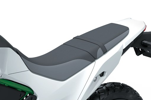 Another closeup on seat of a motorcycle staged in a white studio background. opens in a new window