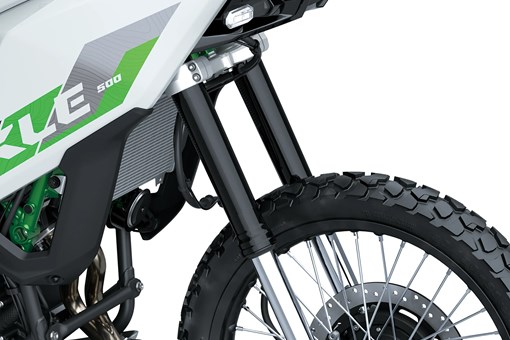 Wheel of a motorcycle staged in a white studio background. opens in a new window