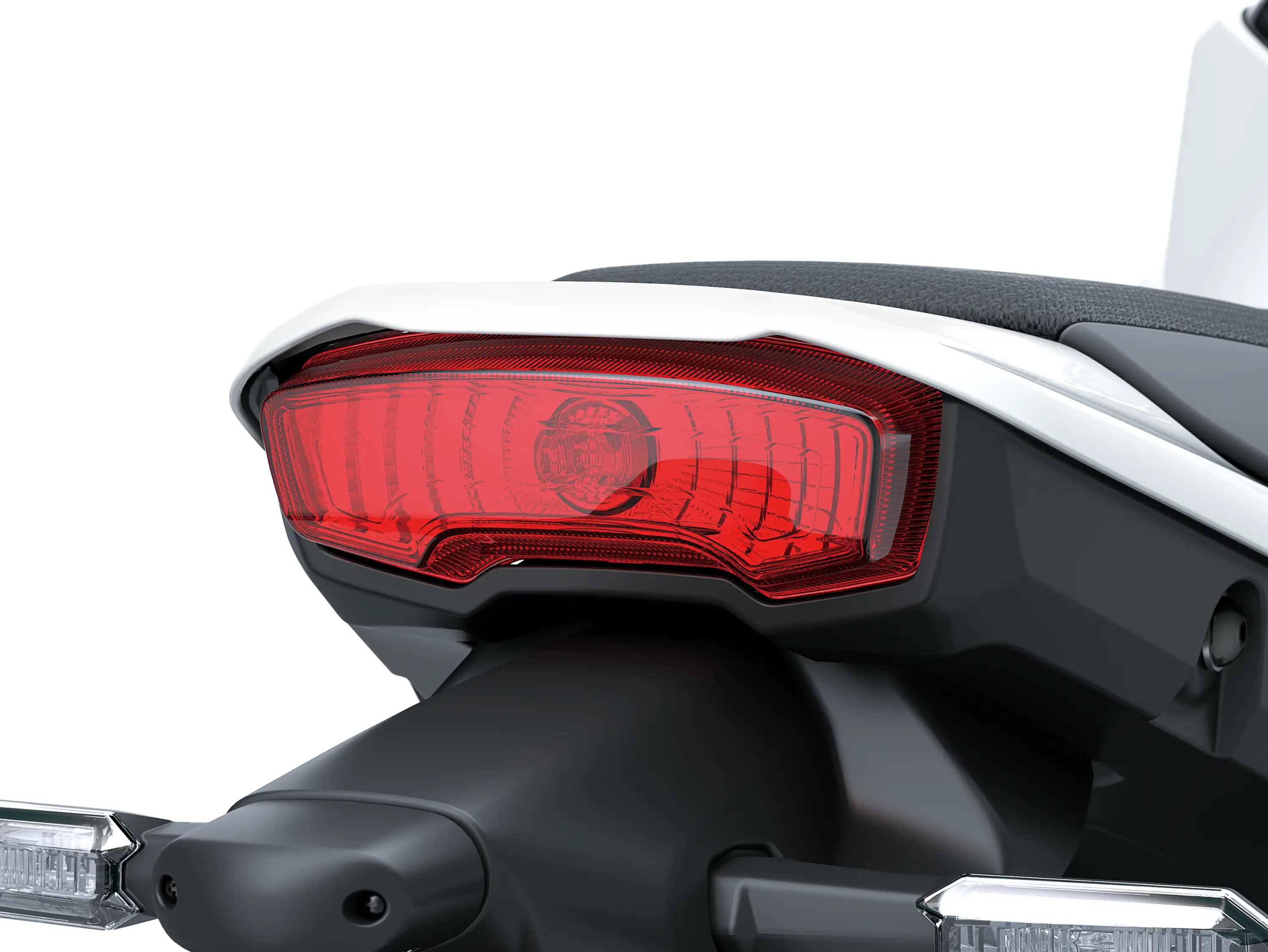 Closeup on taillight of a motorcycle staged in a white studio background.